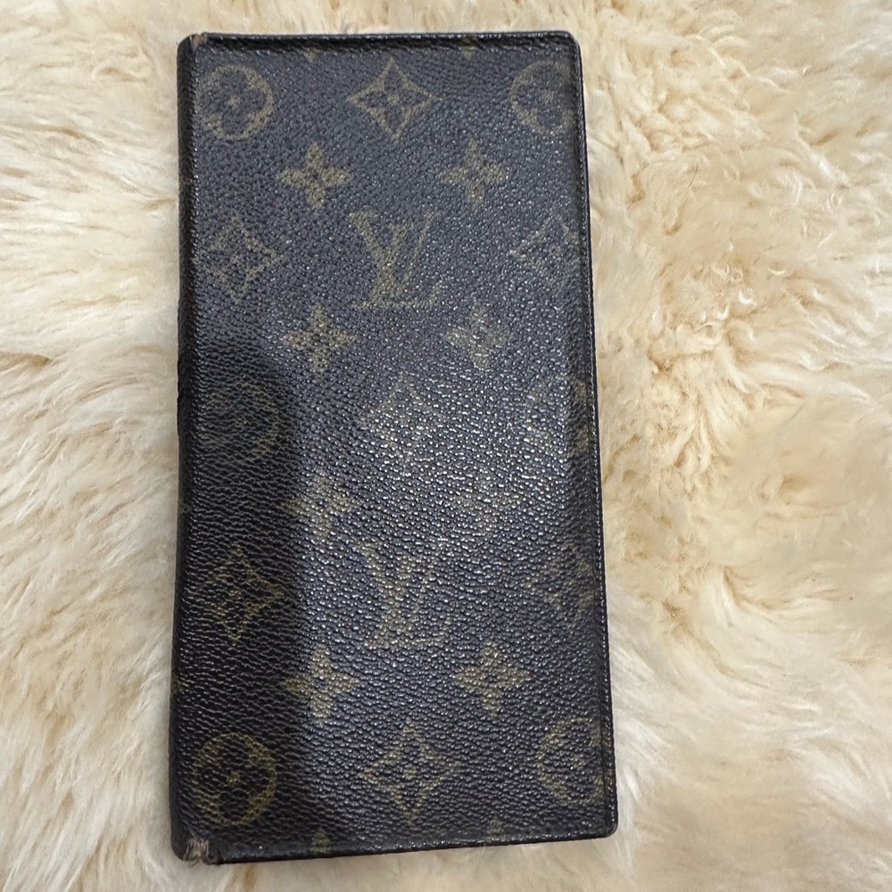 LV vintage man long monogram wallet in a fair condition